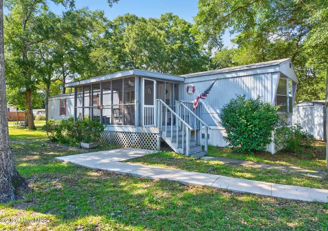 Photo 1 of Manufactured home for sale at 1649 Woodview Cir Sw, Ocean Isle Beach, NC 28469 | MLS# 100601713 | Listing updated on 2026-09-15