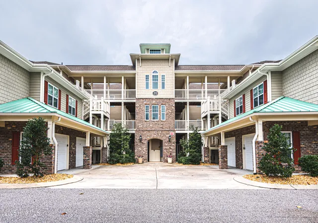 Listing Photo 1 - Condo for sale in building located at 7825 High Market St, Sunset Beach, NC 28468 - Unit #304