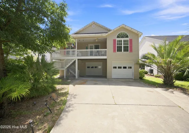Photo 1 of Single family home for sale at 303 E Oak Is Dr, Oak Island, NC 28465 | MLS# 100602801 | Listing updated on 2026-10-06