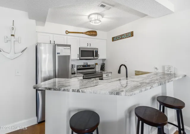 Photo 4 of Condo for sale at 908 Resort Cir #Unit 203, Sunset Beach, NC 28468 | MLS# 100601216 | Listing updated on 2026-09-10