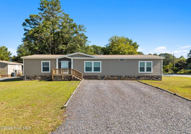 Photo 2 of Manufactured home for sale at 1051 Pine Bur Cir, Sunset Beach, NC 28468 | MLS# 100604394 | Listing updated on 2026-10-23