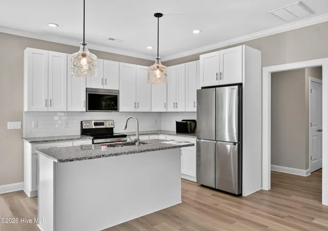 Photo 4 of Single family home for sale at 831 Treasure Cvs Ln SW, Supply, NC 28462 | MLS# 100601407 | Listing updated on 2026-09-18