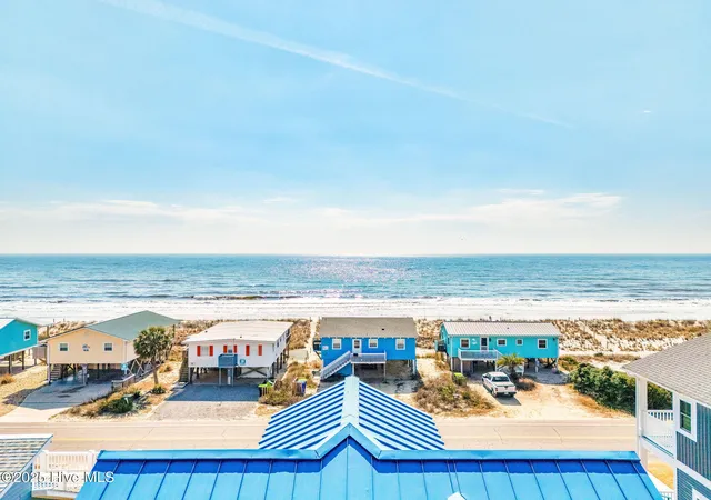 Photo 2 of Single family home for sale at 318 E Beach Dr, Oak Island, NC 28465 | MLS# 100602742 | Listing updated on 2026-10-05