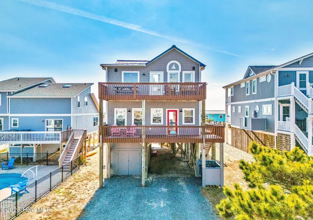 Photo 3 of Single family home for sale at 318 E Beach Dr, Oak Island, NC 28465 | MLS# 100602742 | Listing updated on 2026-10-05