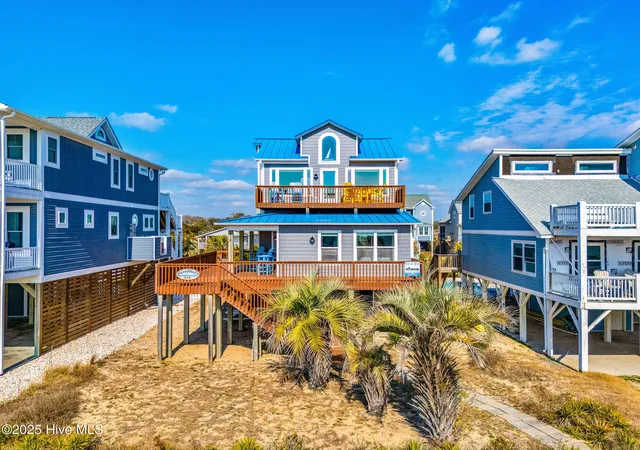 Photo 3 of Single family home for sale at 318 E Beach Dr, Oak Island, NC 28465 | MLS# 100602742 | Listing updated on 2026-10-05