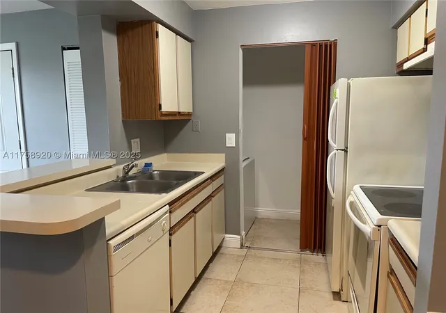 Listing Photo 1 - Condo for sale in building located at 1247 Sw 46Th Ave, Pompano Beach, FL 33069 - Unit #1312