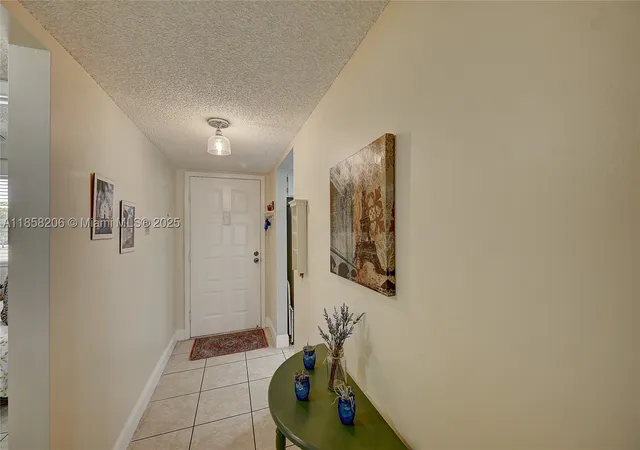 Photo 1 of Condo for sale at 3186 Via Poinciana #203, Lake Worth, FL 33467 | MLS# A11858206 | Listing updated on 2026-09-03