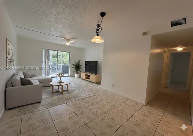 Listing Photo 1 - Condo for sale in building located at 4354 Nw 9Th Ave, Pompano Beach, FL 33064 - Unit #12-1C