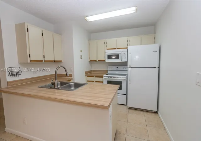 Listing Photo 2 - Condo for sale in building located at 18328 Nw 68Th Ave, Miami, FL 33015 - Unit #P