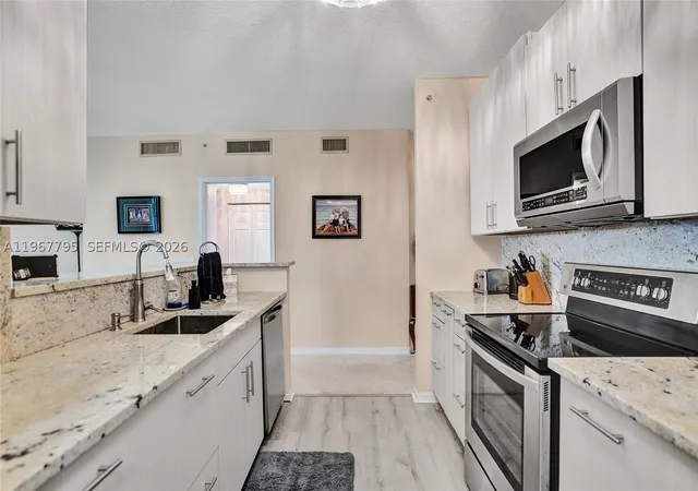 Listing Photo 5 - Condo for sale in building located at 2421 Ne 65Th St, North Lauderdale, FL 33308 - Unit #202