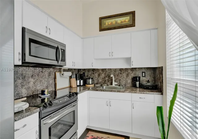Photo 4 of Condo for sale at 7400 W 20Th Ave #402, Hialeah, FL 33016 | MLS# A11970454 | Listing updated on 2026-10-06