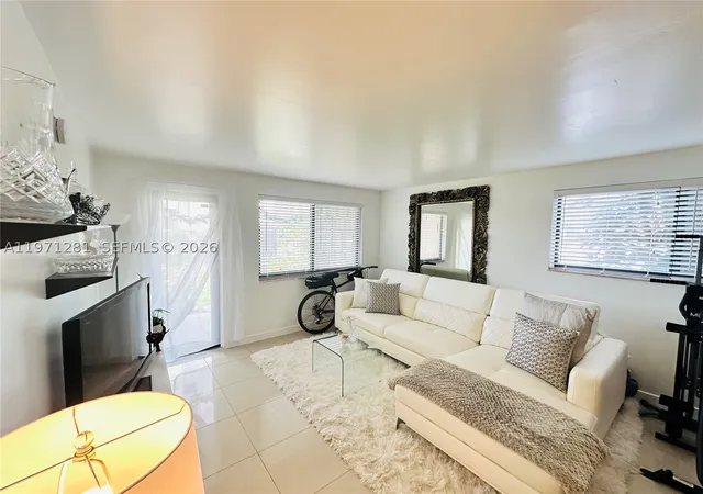 Listing Photo 1 - Condo for sale in building located at 301 Golden Isles Dr, Hallandale Beach, FL 33009 - Unit #114
