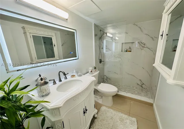 Listing Photo 2 - Condo for sale in building located at 301 Golden Isles Dr, Hallandale Beach, FL 33009 - Unit #114