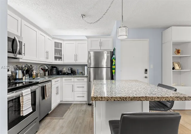 Listing Photo 4 - Condo for sale in building located at 10709 W Clairmont Cir, Tamarac, FL 33321 - Unit #111
