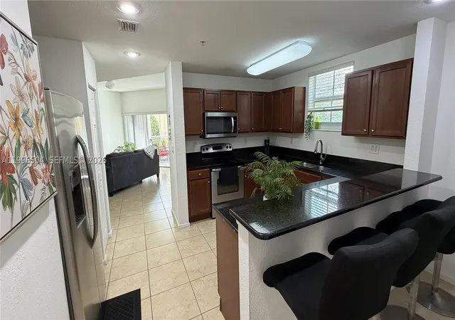 Photo 2 of Condo for sale at 11605 Nw 89th St #220, Doral, FL 33178 | MLS# A11996504 | Listing updated on 2026-10-06