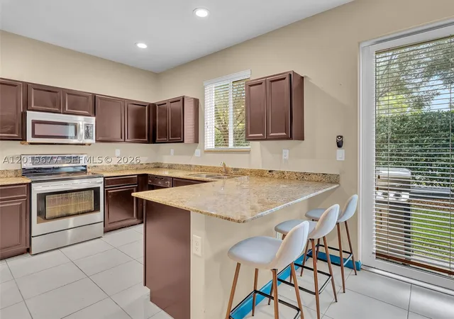 Townhouse for sale at 1410 Nw 214Th Ter, Miami, FL 33169 | MLS# A12015677