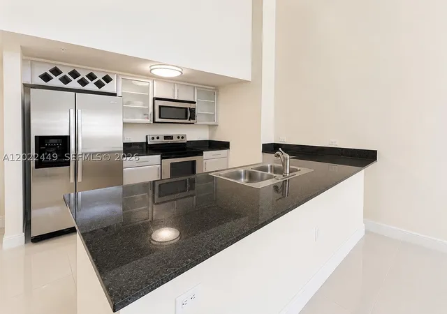 Photo 2 of Townhouse for sale at 1871 Nw S River Dr #A04, Miami, FL 33125 | MLS# A12022449 | Listing updated on 2026-09-09