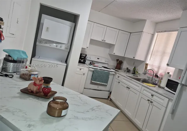 Photo 2 of Condo for sale at 6195 Nw 186Th St #106, Hialeah, FL 33015 | MLS# A12023234 | Listing updated on 2026-09-01
