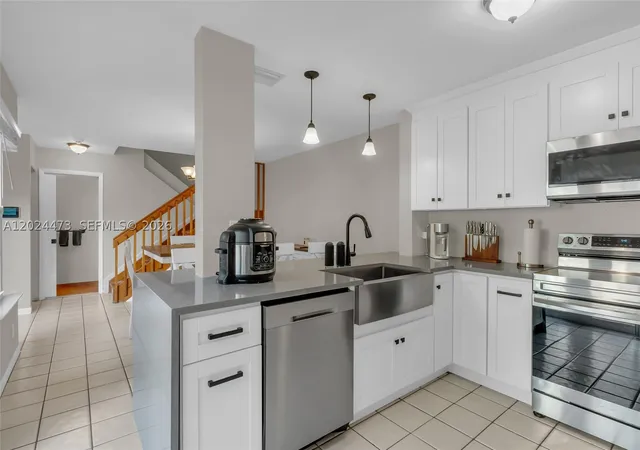 Photo 3 of Townhouse for sale at 11022 Chandler Dr, Hollywood, FL 33026 | MLS# A12024473 | Listing updated on 2026-09-10