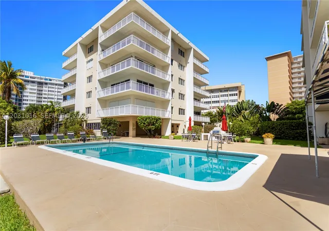 Listing Photo 1 - Condo for sale in building located at 120 Golden Isles Dr, Hallandale Beach, FL 33009 - Unit #23B