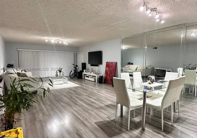 Listing Photo 1 - Condo for sale in Summertree Village located at 601 Ives Dairy Rd, Miami, FL 33179 - Unit #401-8