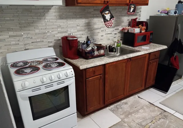 Photo 3 of Sale Pending at 1100 Nw 57th St, Miami, FL 33127 | MLS# A12032096 | Listing updated on 2026-09-25