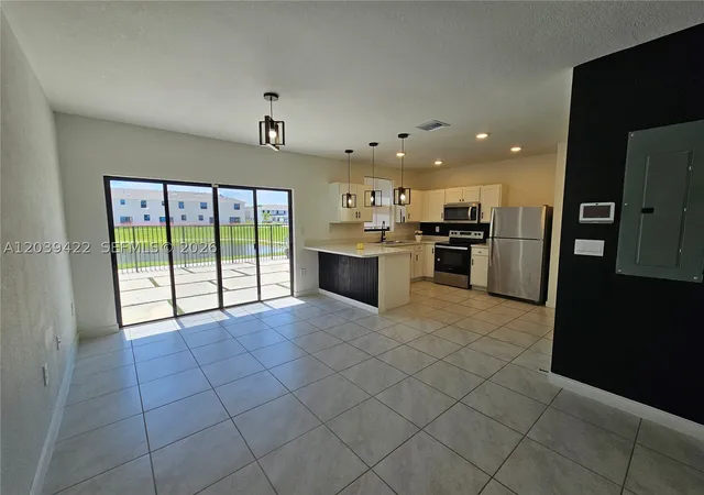 Photo 1 of Townhouse for sale at 1473 Ne 5th Ave #1473, Florida City, FL 33034 | MLS# A12039422 | Listing updated on 2026-09-10