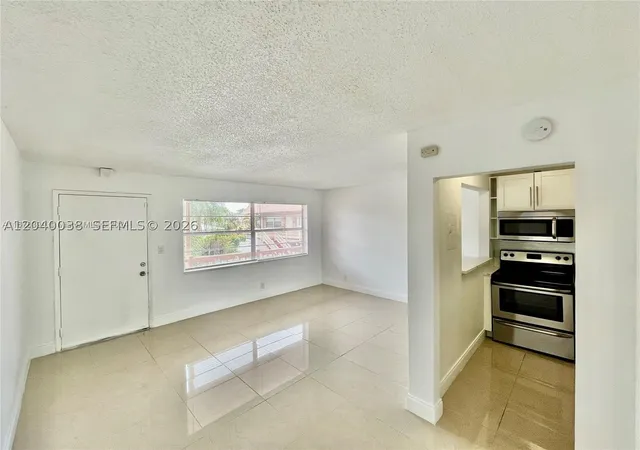 Listing Photo 1 - Condo for sale in building located at 241 Se 9Th Ave, Pompano Beach, FL 33060 - Unit #207