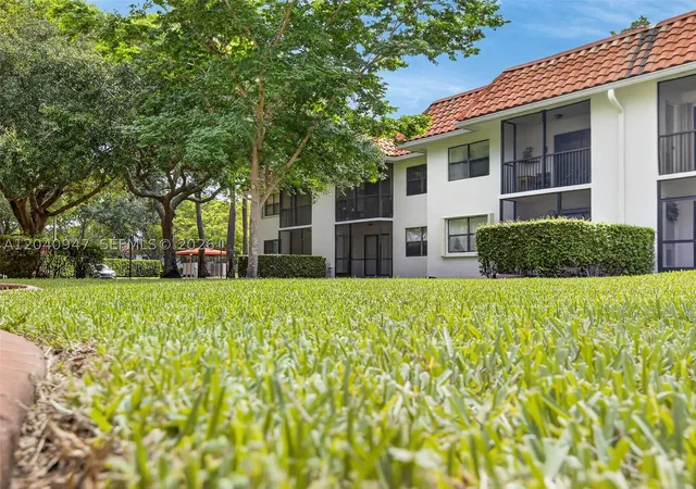 Listing Photo 1 - Condo for sale in building located at 15718 E Waterside Cir, Sunrise, FL 33326 - Unit #105