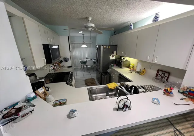 Photo 4 of Condo for sale at 9551 Weldon Cir #E107, Tamarac, FL 33321 | MLS# A12044459 | Listing updated on 2026-09-20