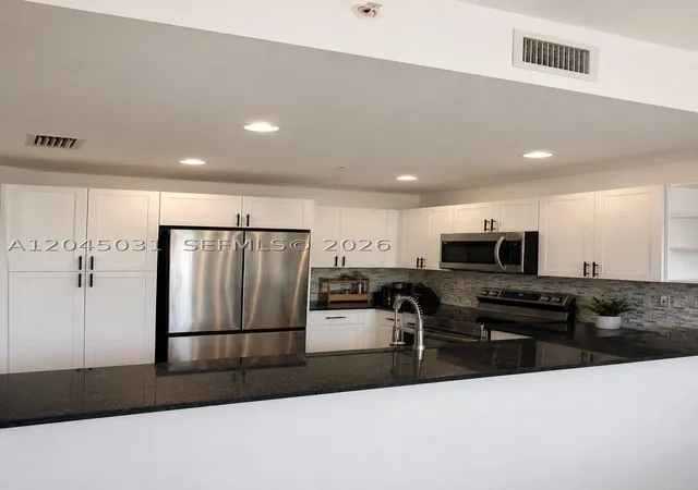 Photo 2 of Condo for sale at 10885 Nw 89Th Ter #203, Doral, FL 33178 | MLS# A12045031 | Listing updated on 2026-09-10