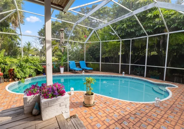 Single family home for sale at 9720 Palmetto Club Ln W, Miami, FL 33157 | MLS# A12043541