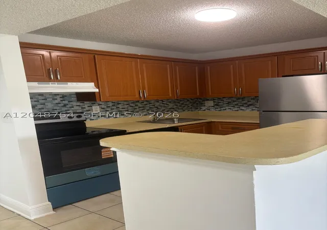 Photo 2 of Condo for sale at 7110 Nw 179th St #211, Hialeah, FL 33015 | MLS# A12048754 | Listing updated on 2026-08-30