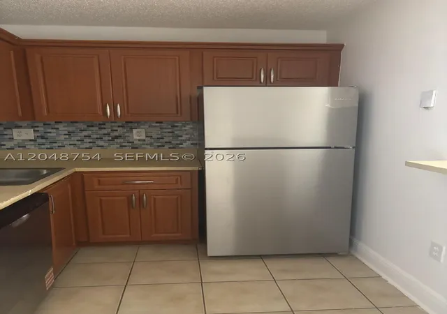 Photo 3 of Condo for sale at 7110 Nw 179th St #211, Hialeah, FL 33015 | MLS# A12048754 | Listing updated on 2026-08-30