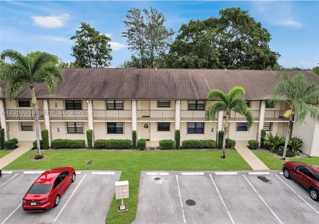 Listing Photo 1 - Condo for sale in building located at 23442 Lyons Rd, Boca Raton, FL 33428 - Unit #404