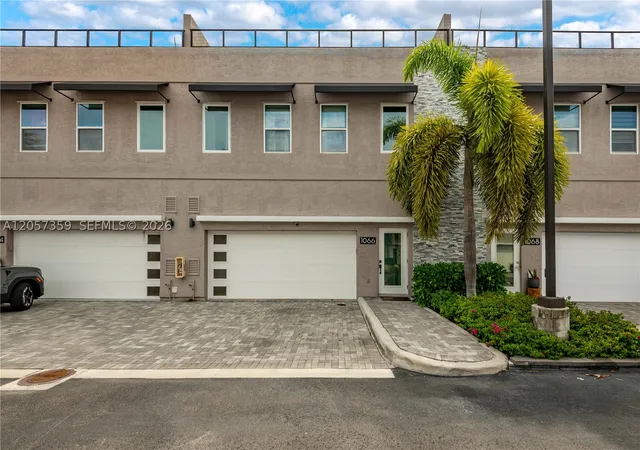 Photo 1 of Townhouse for sale at 1066 Ne 35th St, Oakland Park, FL 33334 | MLS# A12057359 | Listing updated on 2026-09-09