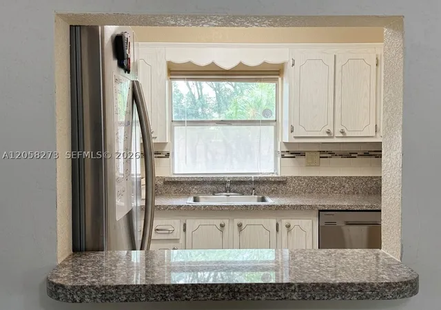 Listing Photo 5 - Condo for sale in building located at 9801 Sunrise Lakes Blvd, Sunrise, FL 33322 - Unit #203