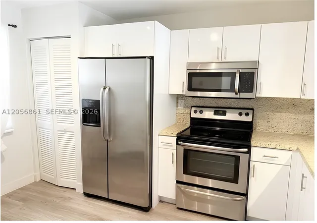 Photo 4 of Condo for sale at 1000 Colony Point Cir #308, Pembroke Pines, FL 33026 | MLS# A12056861 | Listing updated on 2026-09-07