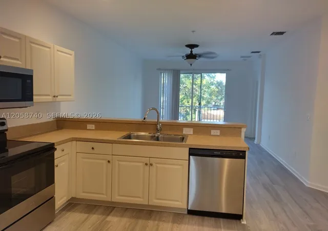 Photo 2 of Condo for sale at 1960 Freeport Ln #1960, Riviera Beach, FL 33404 | MLS# A12058740 | Listing updated on 2026-09-11