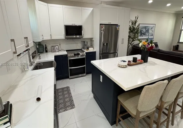 Photo 3 of Townhouse for sale at 11623 Nw 78Th St, Doral, FL 33178 | MLS# A12059333 | Listing updated on 2026-09-10