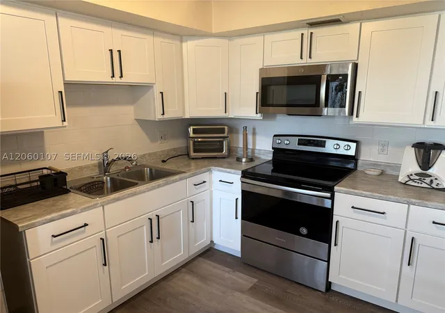 Photo 4 of Condo for sale at 3720 Harrison St #1, Hollywood, FL 33021 | MLS# A12060107 | Listing updated on 2026-09-10