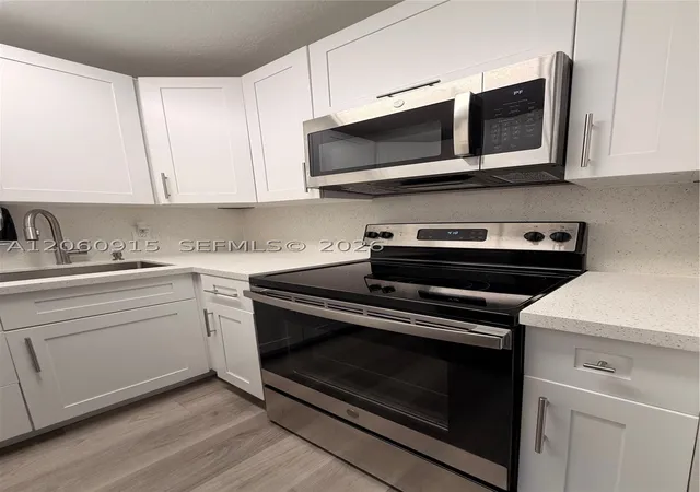 Listing Photo 4 - Condo for sale in Fifty Fifty Condominiums located at 5050 Nw 7Th St, Miami, FL 33126 - Unit #511