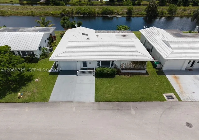 Photo 2 of Single family home for sale at 7100 Nw 66th Ter, Tamarac, FL 33321 | MLS# A12063725 | Listing updated on 2026-10-06