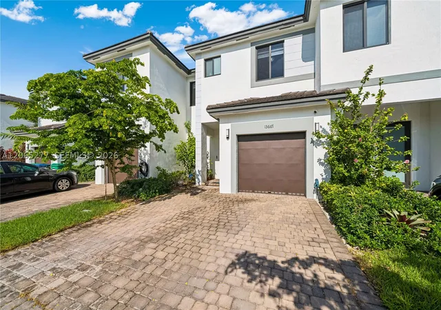Photo 2 of Townhouse for sale at 13667 Sw 157th Ct, Miami, FL 33196 | MLS# A12065277 | Listing updated on 2026-09-01