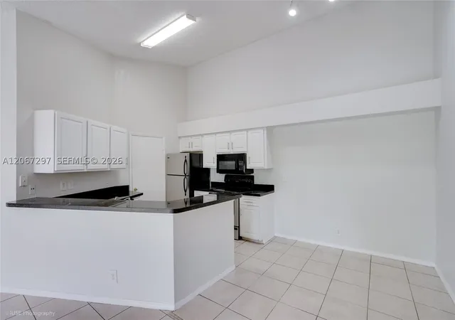 Photo 3 of Condo for sale at 9999 Summerbreeze Dr #409, Sunrise, FL 33322 | MLS# A12067297 | Listing updated on 2026-09-16