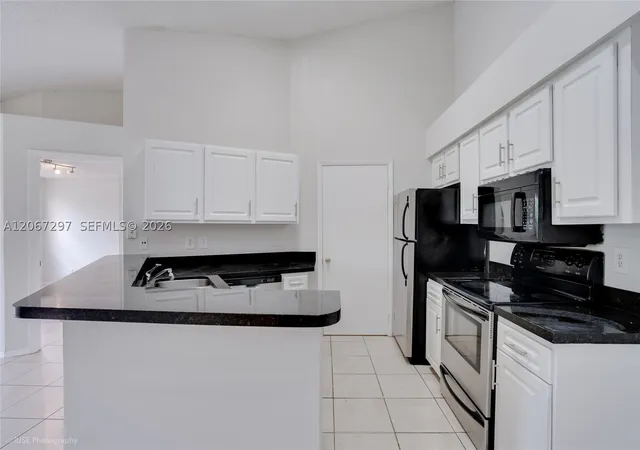 Photo 4 of Condo for sale at 9999 Summerbreeze Dr #409, Sunrise, FL 33322 | MLS# A12067297 | Listing updated on 2026-09-16