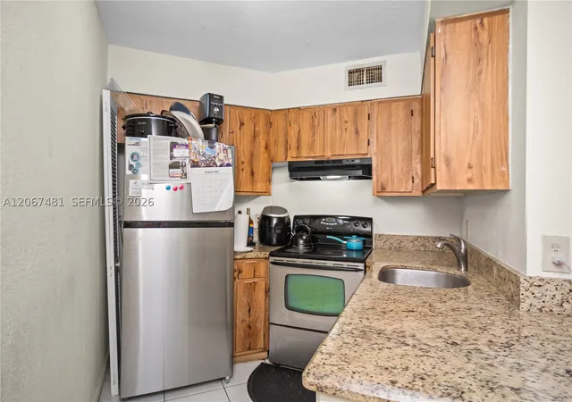 Photo 2 of Sale Pending at 213 Lake Pointe Dr #203, Oakland Park, FL 33309 | MLS# A12067481 | Listing updated on 2026-09-14