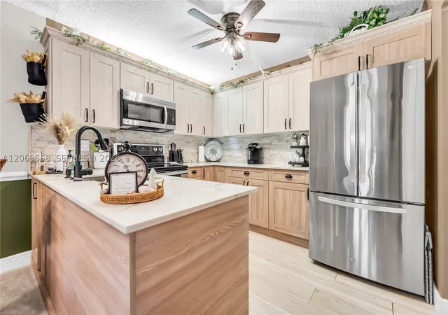 Photo 3 of Condo for sale at 3561 Pine Tree Ct #D-1, Green Acres, FL 33463 | MLS# A12069568 | Listing updated on 2026-09-12