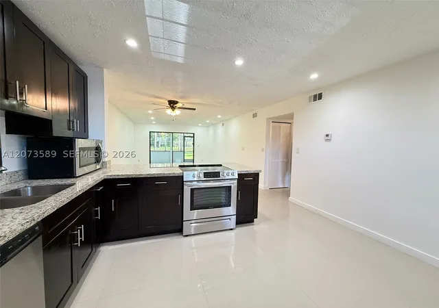 Photo 1 of Condo for sale at 6095 N Sabal Palm Blvd #103, Tamarac, FL 33319 | MLS# A12073589 | Listing updated on 2026-09-13