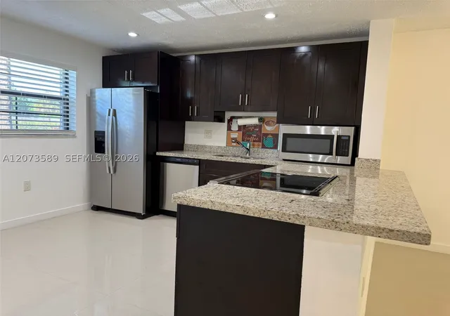 Photo 2 of Condo for sale at 6095 N Sabal Palm Blvd #103, Tamarac, FL 33319 | MLS# A12073589 | Listing updated on 2026-09-13